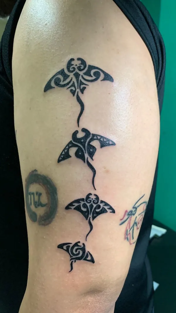 Real community tattoo placement: Ahmad - small mantas
