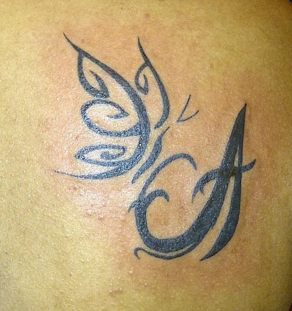 Real community tattoo placement: Akila - Butterfly on A