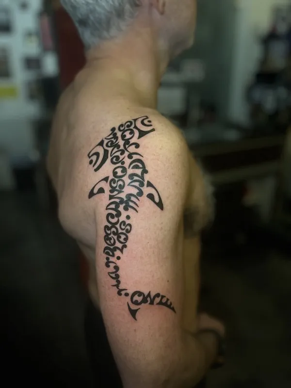 Real community tattoo placement: Alberto - Maorigram shark