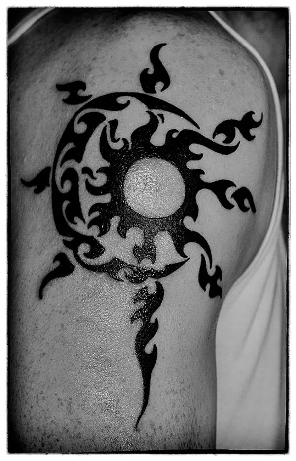 Real community tattoo placement: Alessio - Tribal sun moon