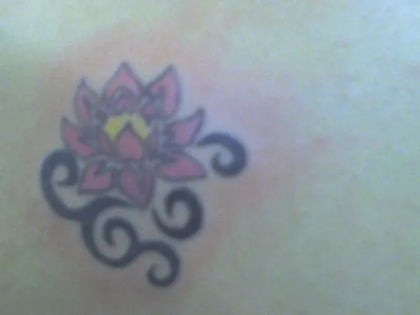 Real community tattoo placement: Amber - Tribal lotus