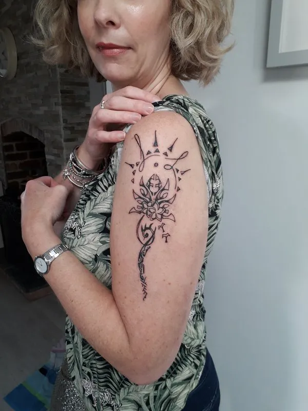 Real community tattoo placement: Angela - Family lotus