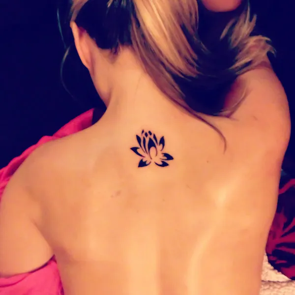 Real community tattoo placement: Anna - lotus flower
