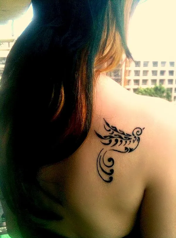 Real community tattoo placement: Ariana - swallow
