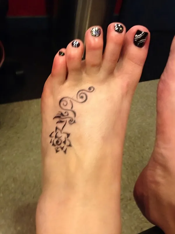 Real community tattoo placement: Ash - Lotus & swallow