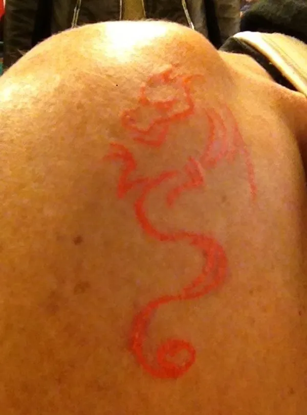Real community tattoo placement: Blair - Stylized dragon