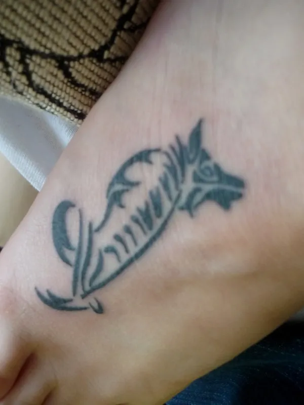 Real community tattoo placement: Bodil - Wolf and gladiolus