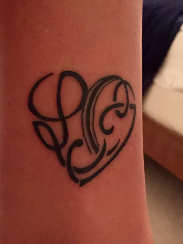 Real community tattoo placement: Carina - L+C+C+C+J heart