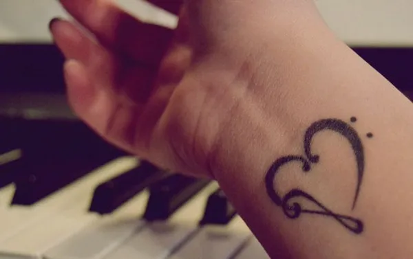 Real community tattoo placement: Elle - Musical heart