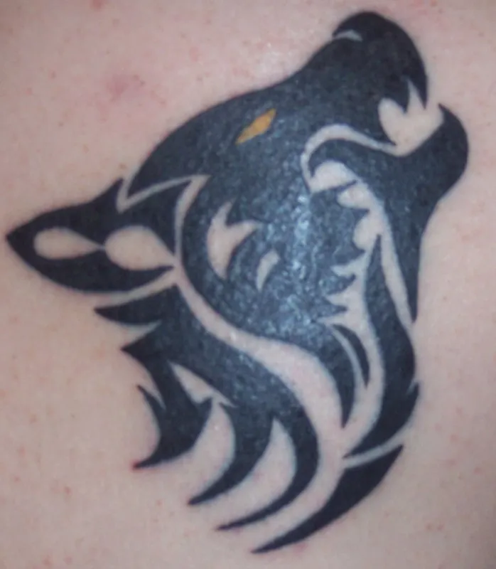 Real community tattoo placement: Ezra - Wolf
