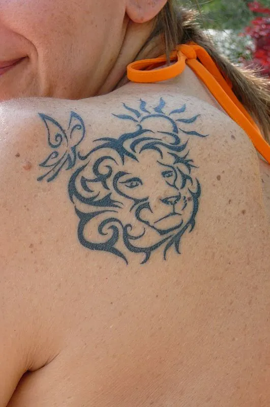 Real community tattoo placement: Gabriella - Lion, butterfly, sun