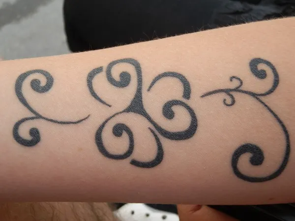 Real community tattoo placement: Gail - Triskell clover