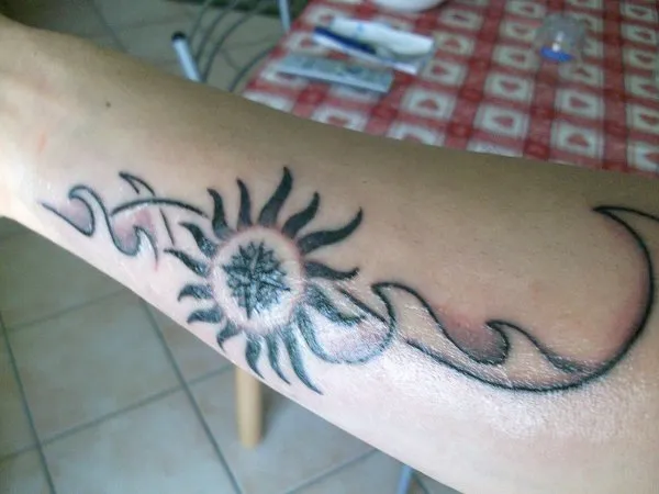 Real community tattoo placement: Giuseppe - Sun, wind, waves