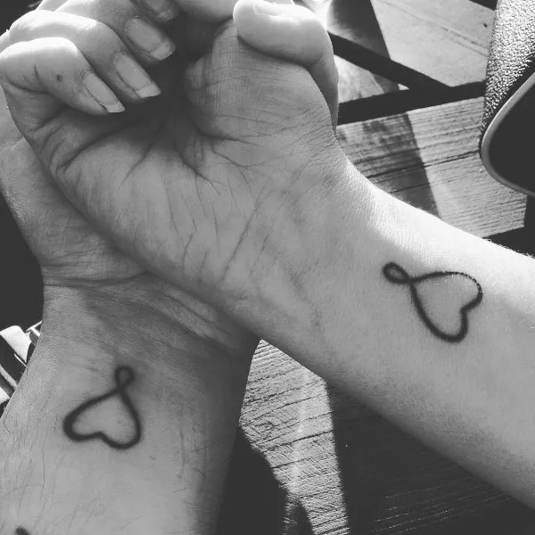 Real community tattoo placement: Guest - infinity hearts
