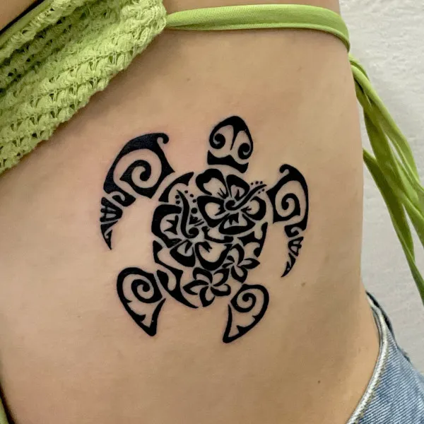 Real community tattoo placement: Guest - flowers turtle