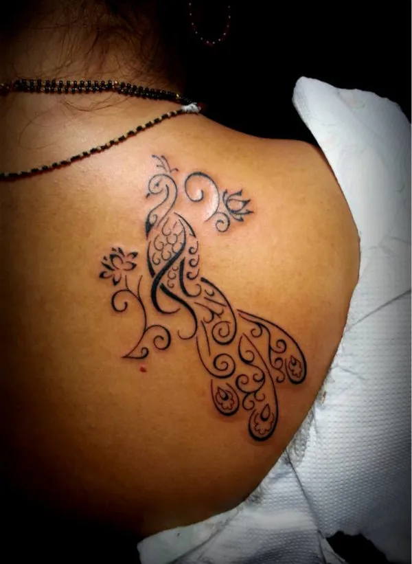 Real community tattoo placement: Guest - peacock lotus