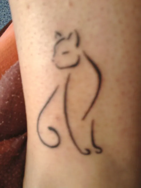 Real community tattoo placement: Jade - Stylized cat
