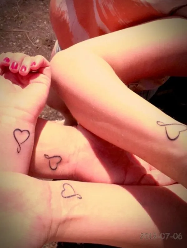 Real community tattoo placement: Jaime - infinity hearts