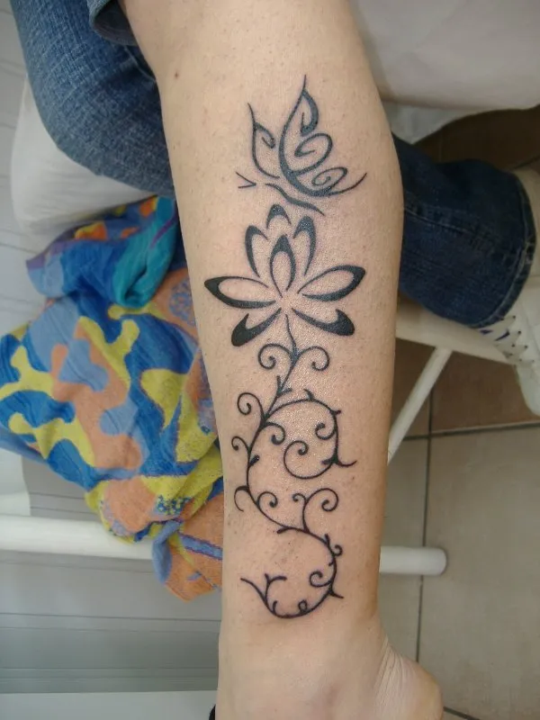 Real community tattoo placement: Ladybrain - Lotus and butterfly