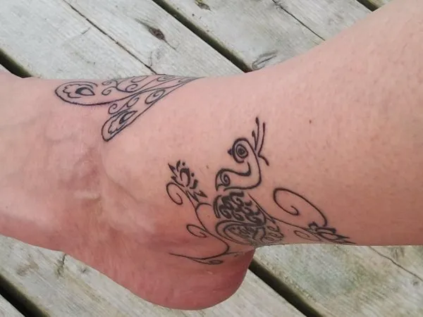 Real community tattoo placement: Lesa - Peacock and lotus
