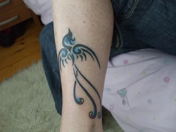 Real community tattoo placement: Lesley - Small phoenix