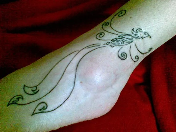 Real community tattoo placement: Luana - Phoenix with korus