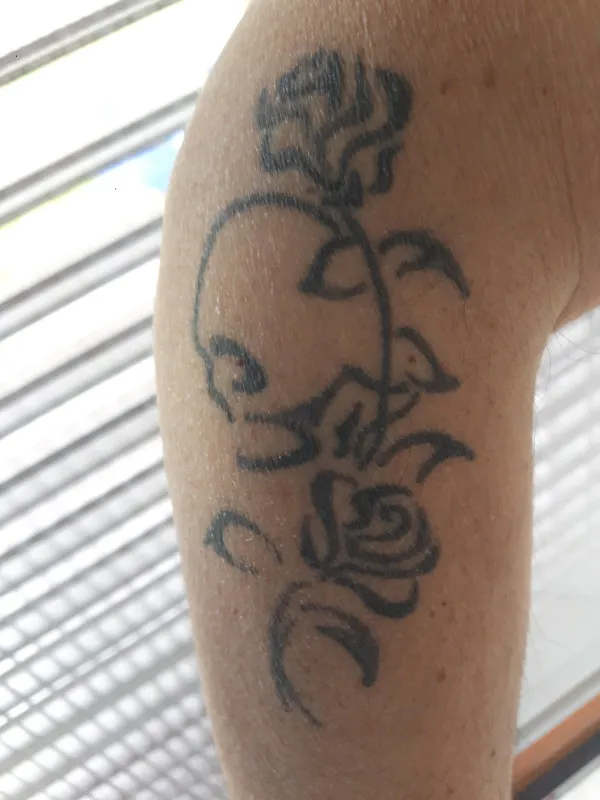 Real community tattoo placement: Luca - skull and roses
