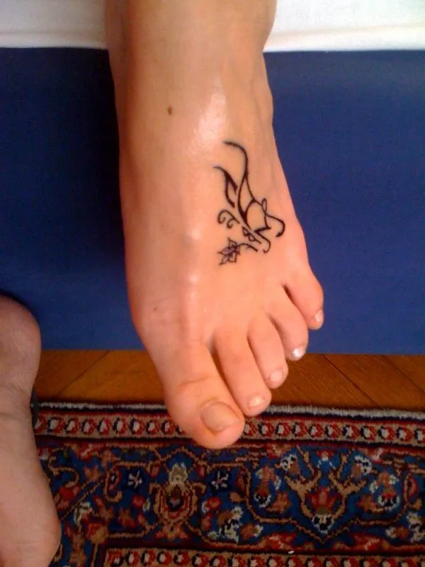 Real community tattoo placement: Manu - A+M butterfly