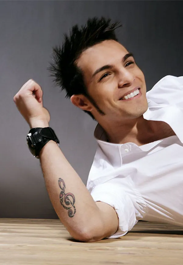 Real community tattoo placement: Marco Carta - Treble Clef