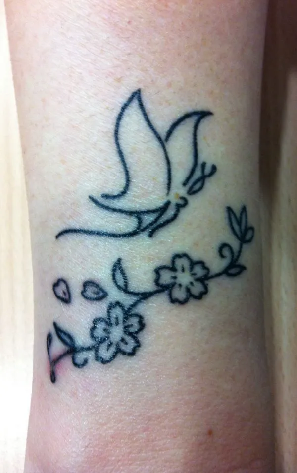 Real community tattoo placement: Mari - M+A butterfly