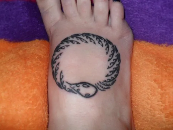 Real community tattoo placement: Maurina - Ouroboros