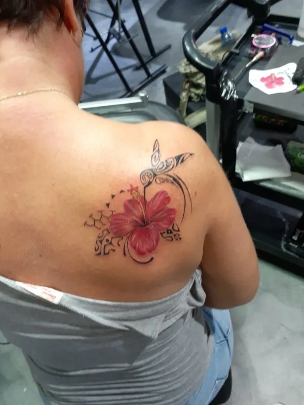 Real community tattoo placement: Michaela - Hummingbird & hibiscus