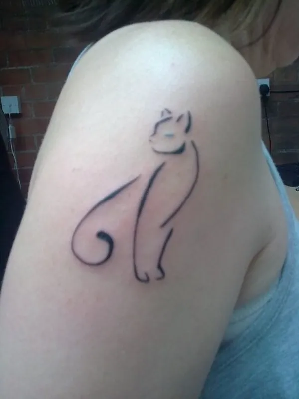Real community tattoo placement: Michele - Stylized cat