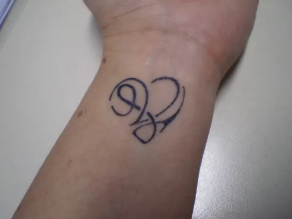 Real community tattoo placement: Pam - L+V heart
