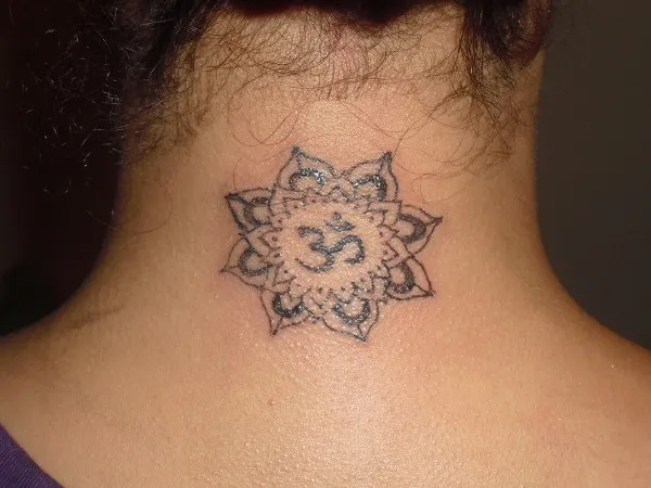 Real community tattoo placement: Pamela - Lotus and Aum
