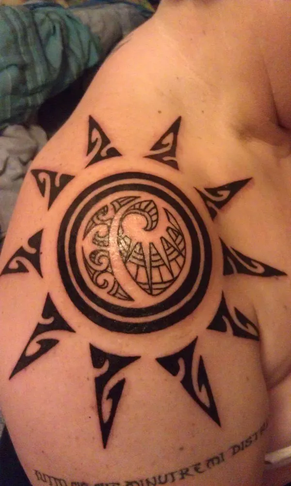Real community tattoo placement: Paola - Sun disk