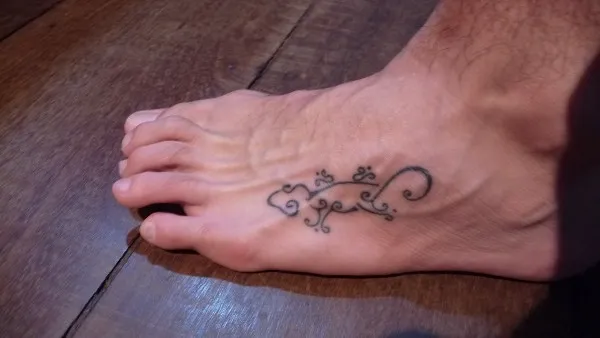 Real community tattoo placement: Patrick - Stylized gecko