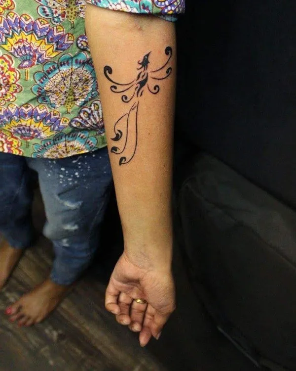 Real community tattoo placement: Guest - Phoenix koru