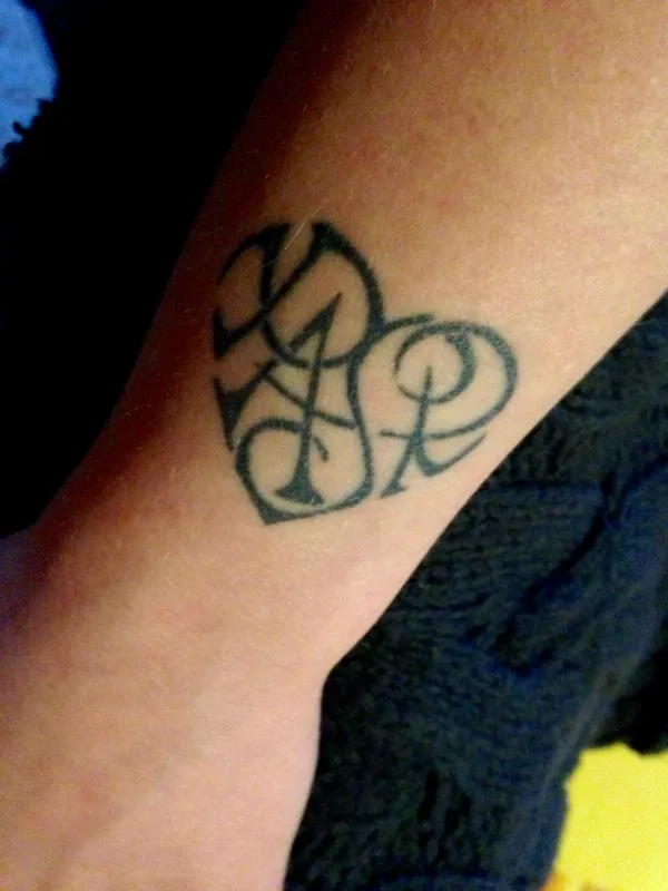 Real community tattoo placement: Rachele - P+A+S+R heart
