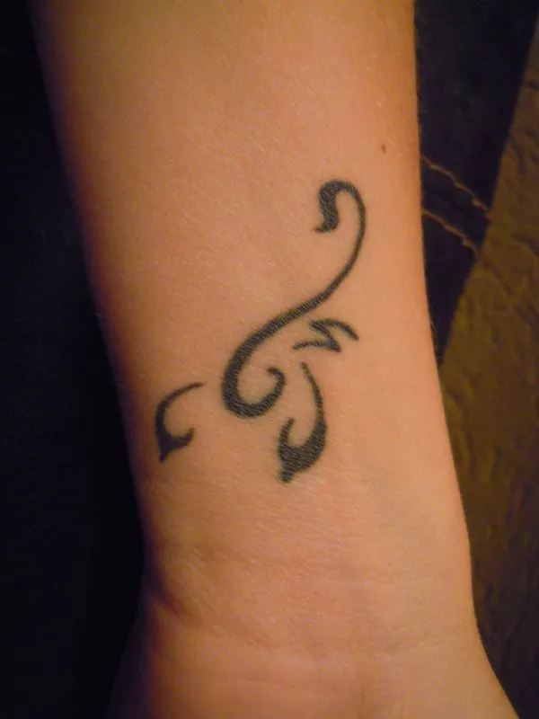 Real community tattoo placement: Renata - Stylized scorpion