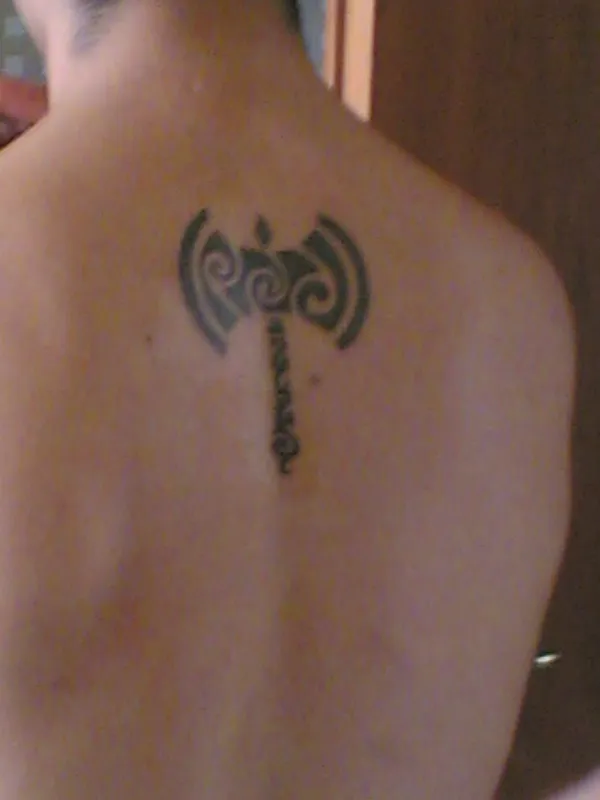Real community tattoo placement: Renzo - Tribal labrys