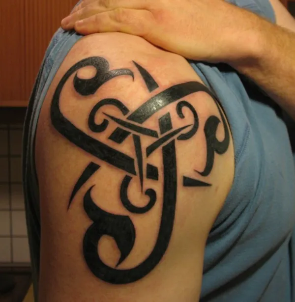 Real community tattoo placement: Steingrimur - Tribal triskell