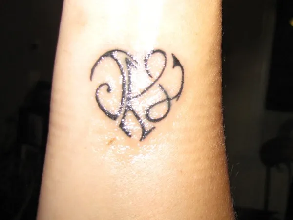 Real community tattoo placement: Theresa - J+K+L heart