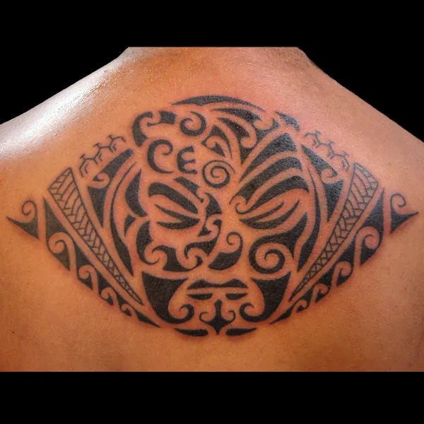 Real community tattoo placement: Tiki tattoo - Mana