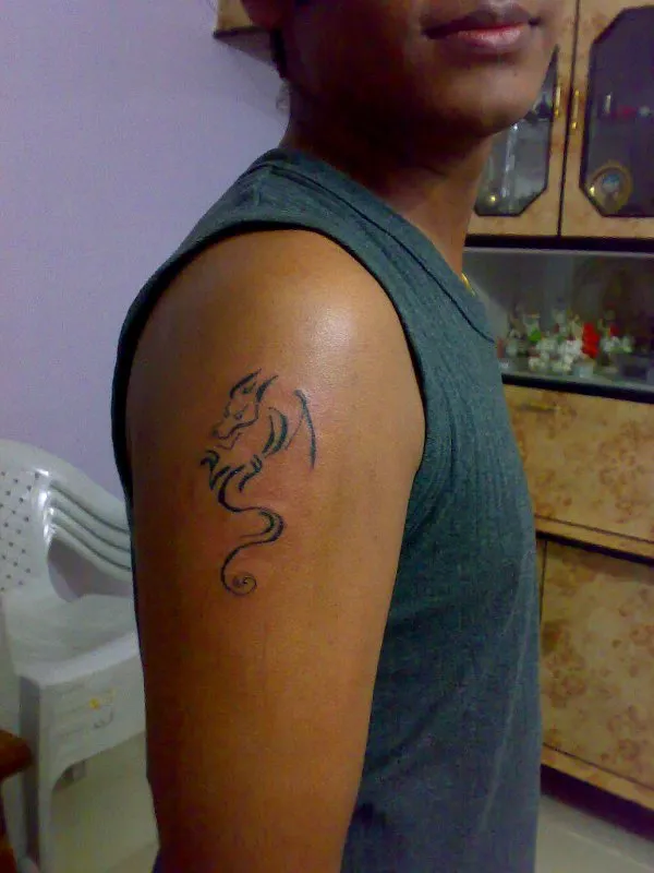 Real community tattoo placement: ZivenTattoos - Stylized dragon