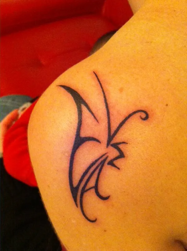 Real community tattoo placement: Amira - M+E+L+A butterfly