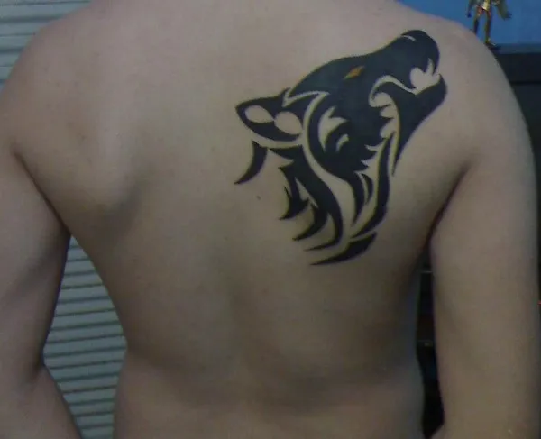 Real community tattoo placement: Jorge - Tribal wolf