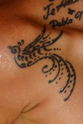 Nina Roca Swallow tattoo on shoulder detail