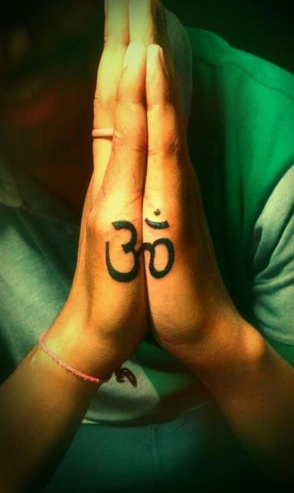 Aum tattoo on praying hands: inked placement real user tattoo photo