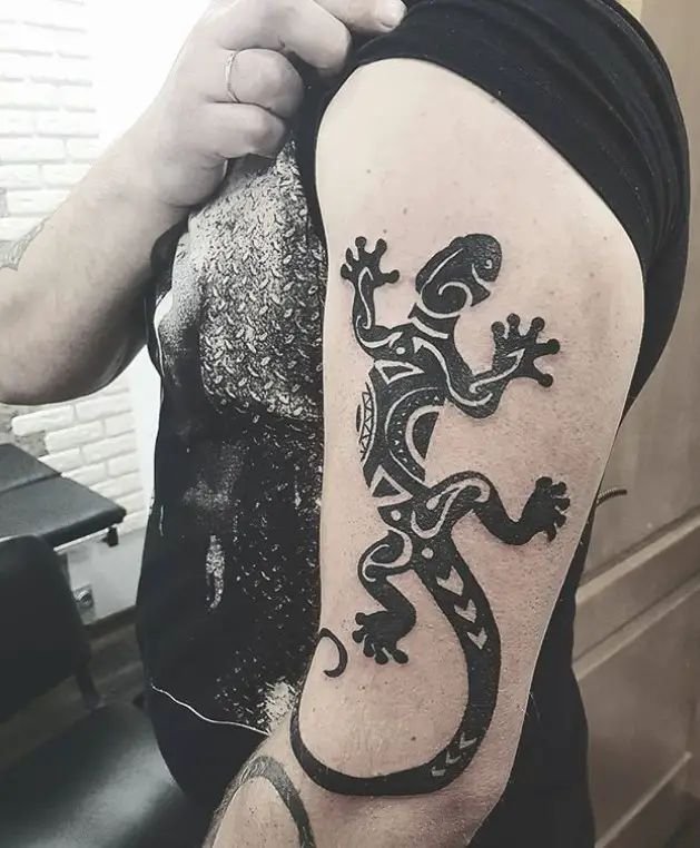 Maori inspired lizard tattoo on upper arm: inked placement real user tattoo photo